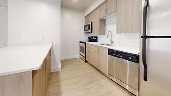 Kitchen with wooden cabinets and stainless steel appliances